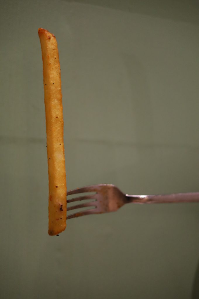 One long potato specimen. Fork for scale.